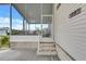 Relaxing screened porch with comfortable seating and a view of the outdoors at 9790 66Th N St # 89, Pinellas Park, FL 33782