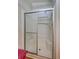 Shower featuring glass doors, built in seat, and detachable head at 9790 66Th N St # 89, Pinellas Park, FL 33782