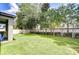 Spacious backyard featuring a lush green lawn and tasteful landscaping for serene outdoor living at 107 Dakota Hill Dr, Seffner, FL 33584