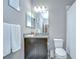 Bathroom featuring a dark wood cabinet, a granite countertop, and a shower-tub combo at 107 Dakota Hill Dr, Seffner, FL 33584