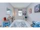Bonus room features a pinball machine, stylish furnishings, and natural light at 107 Dakota Hill Dr, Seffner, FL 33584