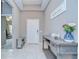 Inviting foyer featuring neutral tile flooring and a stylish console table at 107 Dakota Hill Dr, Seffner, FL 33584