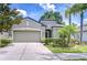 Charming single-story home boasts a well-manicured lawn and lush landscaping at 107 Dakota Hill Dr, Seffner, FL 33584