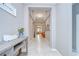 Spacious hallway featuring modern artwork and elegant tray ceilings at 107 Dakota Hill Dr, Seffner, FL 33584