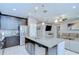 Open-concept kitchen with granite island, stainless appliances, seamlessly connecting to the living area at 107 Dakota Hill Dr, Seffner, FL 33584