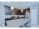 Spacious kitchen with dark cabinets, granite countertops, stainless steel appliances, and an island at 107 Dakota Hill Dr, Seffner, FL 33584
