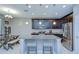 Charming kitchen featuring a large island with seating, stainless appliances, and an adjacent dining area at 107 Dakota Hill Dr, Seffner, FL 33584