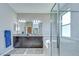 The main bathroom features dual vanities, a soaking tub, and a glass-enclosed shower at 107 Dakota Hill Dr, Seffner, FL 33584