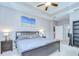 Main bedroom features a tray ceiling, carpet floors, dark wood furnishings, and ensuite bathroom access at 107 Dakota Hill Dr, Seffner, FL 33584