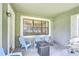Covered patio featuring comfortable seating around a cozy outdoor fire pit at 107 Dakota Hill Dr, Seffner, FL 33584