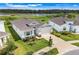 Desirable home near a peaceful lake, featuring a manicured yard and a serene residential setting at 13797 Wineberry Dr, Dade City, FL 33525