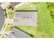 Overhead view shows the roof of a house surrounded by grass at 13797 Wineberry Dr, Dade City, FL 33525