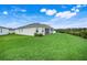 Lush backyard offers ample room for outdoor enjoyment at 13797 Wineberry Dr, Dade City, FL 33525