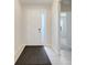 Inviting front entryway with tile flooring, bright lighting, and access to other rooms at 13797 Wineberry Dr, Dade City, FL 33525