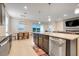 Open kitchen and dining area featuring modern appliances, island, and a seamless flow to living spaces at 13797 Wineberry Dr, Dade City, FL 33525