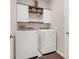 Functional laundry room features a washer and dryer at 13797 Wineberry Dr, Dade City, FL 33525