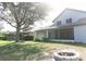 Inviting backyard with fire pit and spacious lawn, ideal for outdoor gatherings and leisure at 26620 Shoregrass Dr, Wesley Chapel, FL 33544
