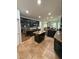 A spacious kitchen features dark wood cabinets, granite countertops, stainless steel appliances, and a center island at 26620 Shoregrass Dr, Wesley Chapel, FL 33544