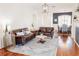 A combined living and dining room with hardwood floors and an open-concept layout perfect for entertaining at 26620 Shoregrass Dr, Wesley Chapel, FL 33544