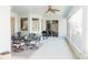 Covered outdoor patio with dining set, grill, screened windows, and sliding door to living area at 26620 Shoregrass Dr, Wesley Chapel, FL 33544