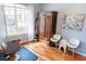 Bright sitting room with wooden floors, stylish furniture, and natural light, perfect for relaxation or hobbies at 26620 Shoregrass Dr, Wesley Chapel, FL 33544
