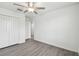 Spacious bedroom featuring a ceiling fan, closet, and ample natural light at 2139 Stellar Brilliance Way, Lutz, FL 33558