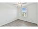 Cozy bedroom with a ceiling fan and a window providing ample natural light at 2139 Stellar Brilliance Way, Lutz, FL 33558