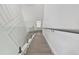 Modern staircase with glass railing and light wood steps leading to the upper level at 2139 Stellar Brilliance Way, Lutz, FL 33558