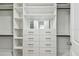 Spacious walk-in closet featuring custom shelving, drawers, and ample storage space at 2139 Stellar Brilliance Way, Lutz, FL 33558
