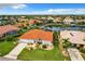 Stunning aerial view of a waterfront home with a pool, lush landscaping, and a private dock at 3723 Toulouse Ct, Punta Gorda, FL 33950
