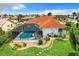 Aerial view of the backyard, featuring a screened-in pool and well-maintained landscaping at 3723 Toulouse Ct, Punta Gorda, FL 33950