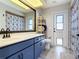 Bathroom features a vanity and a shower/tub with seashell-themed curtains at 3723 Toulouse Ct, Punta Gorda, FL 33950