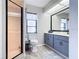 Bathroom featuring a shower with glass door, toilet and vanity at 3723 Toulouse Ct, Punta Gorda, FL 33950