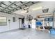 View of an organized garage space with overhead door track and convenient storage shelving at 3723 Toulouse Ct, Punta Gorda, FL 33950
