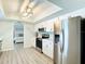 Bright kitchen features white cabinets, modern appliances, and an eat-in area with an open concept at 3723 Toulouse Ct, Punta Gorda, FL 33950