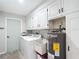 Laundry room featuring a washer, dryer and utility sink with water heater at 3723 Toulouse Ct, Punta Gorda, FL 33950