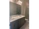 Elegant bathroom with double sinks, a quartz countertop and a marble-look shower at 160 Eagleston Ln, Lakewood Ranch, FL 34240