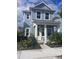 Charming two-story home with a covered front porch and well-maintained landscaping at 160 Eagleston Ln, Lakewood Ranch, FL 34240