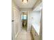 Bathroom with white vanity with sink and toilet at 4571 Clearwater Harbor S Dr, Largo, FL 33770
