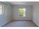 Bedroom featuring carpeted floors, bright windows, and neutral paint throughout at 4571 Clearwater Harbor S Dr, Largo, FL 33770