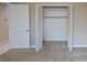 Bright walk-in closet with louvered doors for maximum ventilation and additional door in the room at 4571 Clearwater Harbor S Dr, Largo, FL 33770