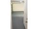 Spacious garage with an epoxy floor, offering ample storage and parking for vehicles at 4571 Clearwater Harbor S Dr, Largo, FL 33770