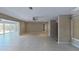 Bright living space featuring neutral tile flooring and recessed lighting at 4571 Clearwater Harbor S Dr, Largo, FL 33770