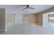 Bright living room with neutral walls, tile floors, and a ceiling fan at 4571 Clearwater Harbor S Dr, Largo, FL 33770