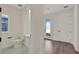 Half bathroom with modern sink and toilet next to entryway with hardwood floors at 130 Bragg Ln, Lakewood Ranch, FL 34240