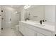 Elegant bathroom features double sinks, a modern shower with glass doors, and a stylish design at 130 Bragg Ln, Lakewood Ranch, FL 34240