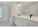 Contemporary bathroom featuring double sinks, modern fixtures, and lots of natural light at 130 Bragg Ln, Lakewood Ranch, FL 34240