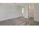 Spacious bedroom featuring neutral carpet and an open closet space at 130 Bragg Ln, Lakewood Ranch, FL 34240