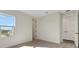 Bedroom featuring neutral carpet, white walls, and a sunny window at 130 Bragg Ln, Lakewood Ranch, FL 34240