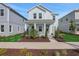 Charming two-story home with covered porch, landscaped front yard and light blue exterior at 130 Bragg Ln, Lakewood Ranch, FL 34240